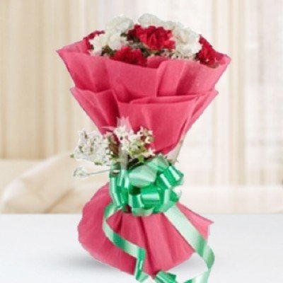 Bunch of 12 red and white Carnations in Nice Pink Wrapping paper Glowing Carnations