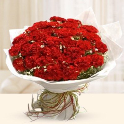 Bunch of 30 Red Carnations with fillers in white packing Supernova Red