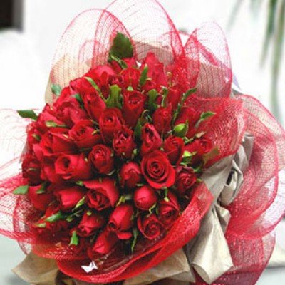 Bunch of 50 Red Roses with greens in Red Net Wrapping Perfect Love at 50