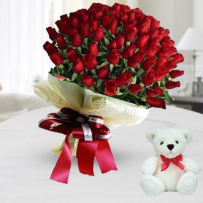 Bunch of 50 Red Roses In Nice Wrapping Paper along with 6 Inch Teddy Bear Perfect Way
