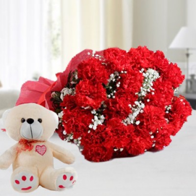 Bunch of 12 Red Carnations in nice wrapping with a 6 Inches Teddy. Way To Her Heart