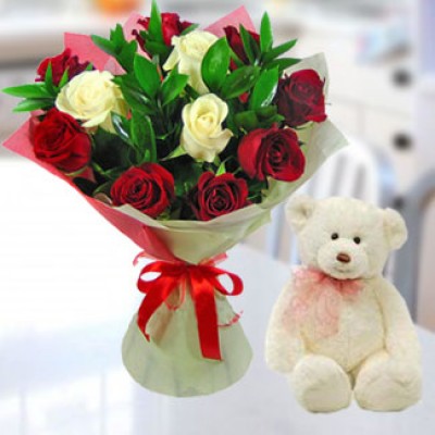 Bunch of 12 Red & White Roses in nice wrapping paper along with 6 Inch Teddy Bear Certainly Romantic