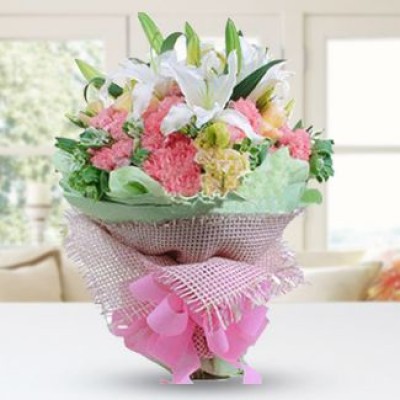 Bunch of 3 stems of White lilies, 20 pink & Yellow carnations with fillers in nice wrapping More Blissful
