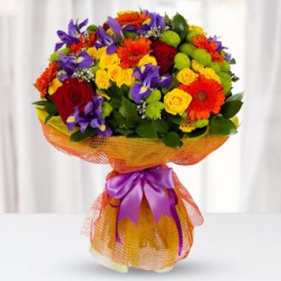Bunch of 6 Gerberas, 5 Red Roses, 5 stems of Yellow spray Rose, 10 stems of Irises & 5 stems of Green button Chrysanthemum with fillers in nice wrapping Bouquet with irises, gerberas and bush roses