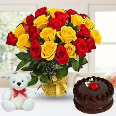 Bunch of 25 Red and Yellow colour roses in paper packing along with 1/2 Kg Chocolate Cake & 6 Inch Teddy Bear Red and Yellow Roses, Cake & Teddy