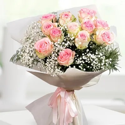 bouquet between a lot of baby breath and 12 Pink Roses rose in nice wrapping Baby Pink Bouquet