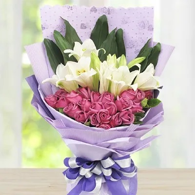 Bunch of 24 purple roses, 4 white lilies with greens nicely wrapped Expresses True Love