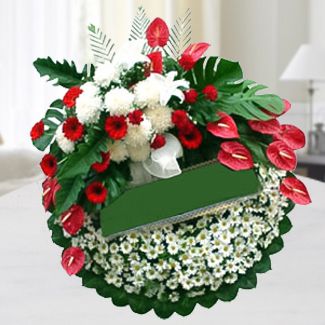 Arrangement of white longiflorum lilies, molucella and fragrant white roses, bound in a complimentary mix of special greens. Bid Farewell