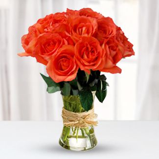 12 Stems of Orange roses in a Glass Vase Passion Roses