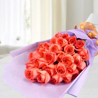 Flat bunch of 24 Beautiful stems of Orange roses nicely wrapped. Fresh Air 24