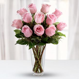 12 Light Pink Roses with fillers in a Glass Vase 12 Light Pink Roses