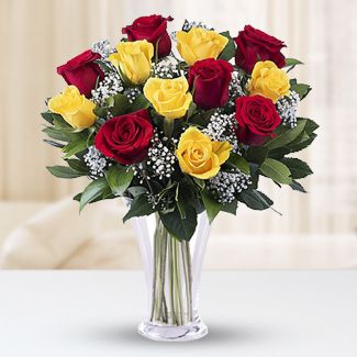Vase of 5 red and 5 yellow roses, gypsophilia and matching greenery. Yellow Blush