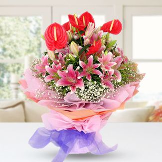 Bunch of 6 Stems of Stargazer and 10 Stems red Anthurium with fillers in nice wrapping Loving Lilies