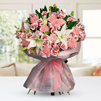 Bunch of 24 Pink Carnations , 12 pink roses and 4 stems of white Lillies with fillers and nice wrapping Deepest Love