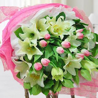 Bouquet of 6 stems of White Casablanca and 10 Stem Pink Tulips in nice wrapping Magical Moment