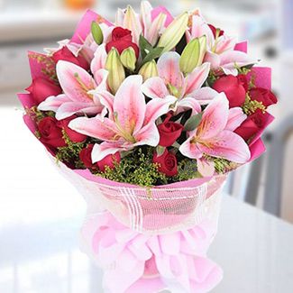 Bouquet of 4 stems of Pink Stargazer Lilies wrapped around with 15 Red Roses & fillers in nice paper wrapper and ribbons. Posh Pink