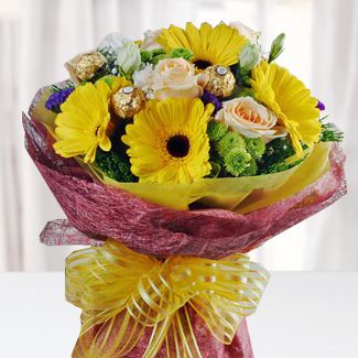 Bunch of 6 Yellow Gerbera, 6 peach Roses, Pompoms, 6 pcs Fererro Rocher and other fillers in nice wrapping Fresh Romance