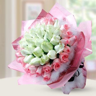 Bouquet of 24 white and 24 pink roses with fillers in nice wrapping. So Much In Love